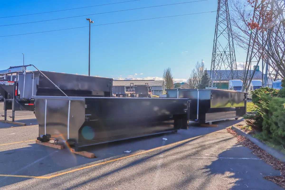 Roll-off dumpster ready for waste disposal at job site for Yard Waste Dumpster Rental in Traverse City